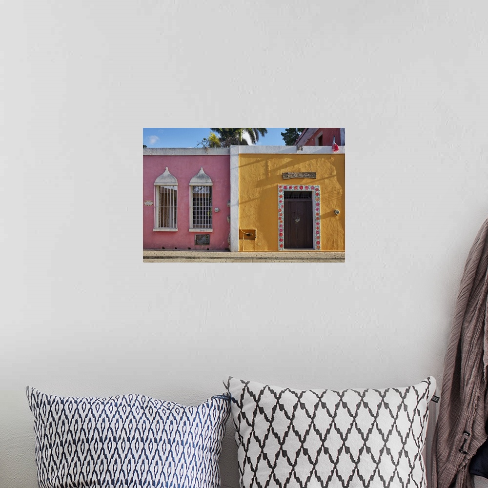 A bohemian room featuring Colorful colonial houses on the "Calzada de los Frailes" street, Valladolid, Yucatan, Mexico.