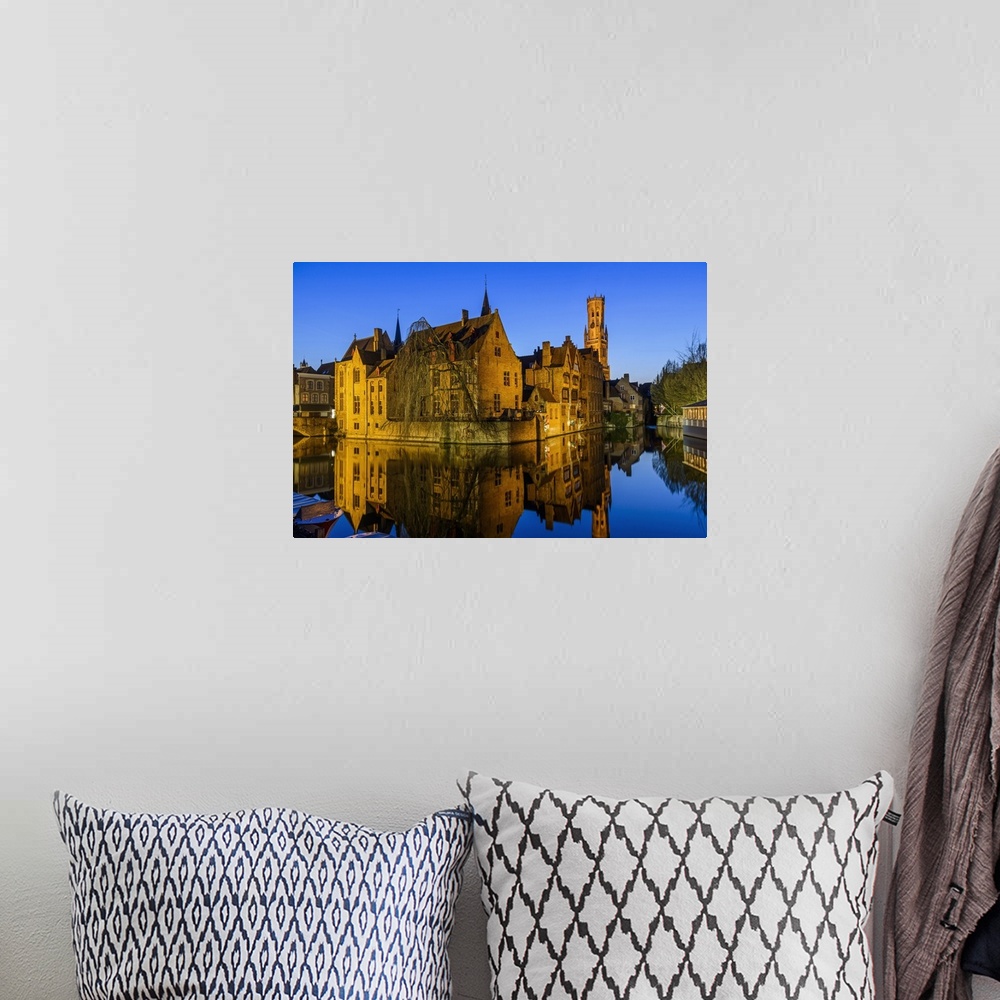A bohemian room featuring Dijver canal with Belfort medieval tower in the background, Bruges, West Flanders, Belgium