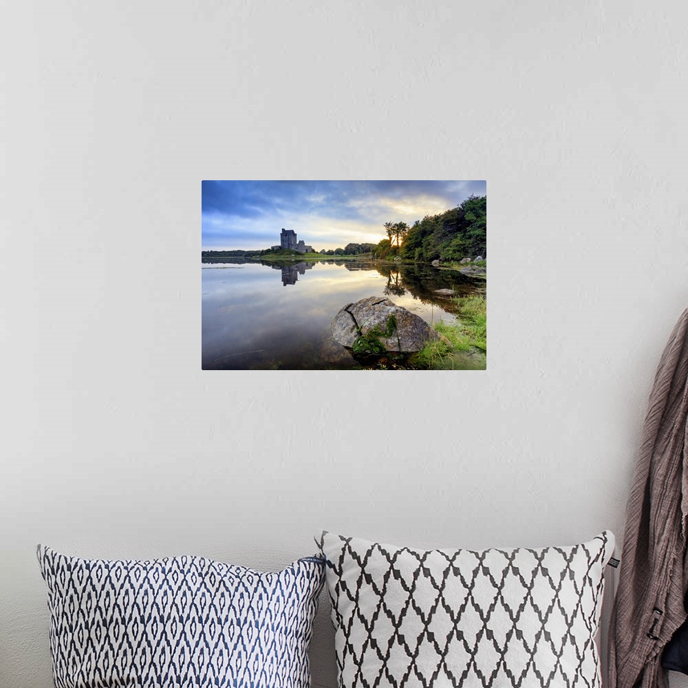 A bohemian room featuring Europe, Dublin, Ireland, Dunguaire castle in Kinvara village at sunrise reflecting in the ocean