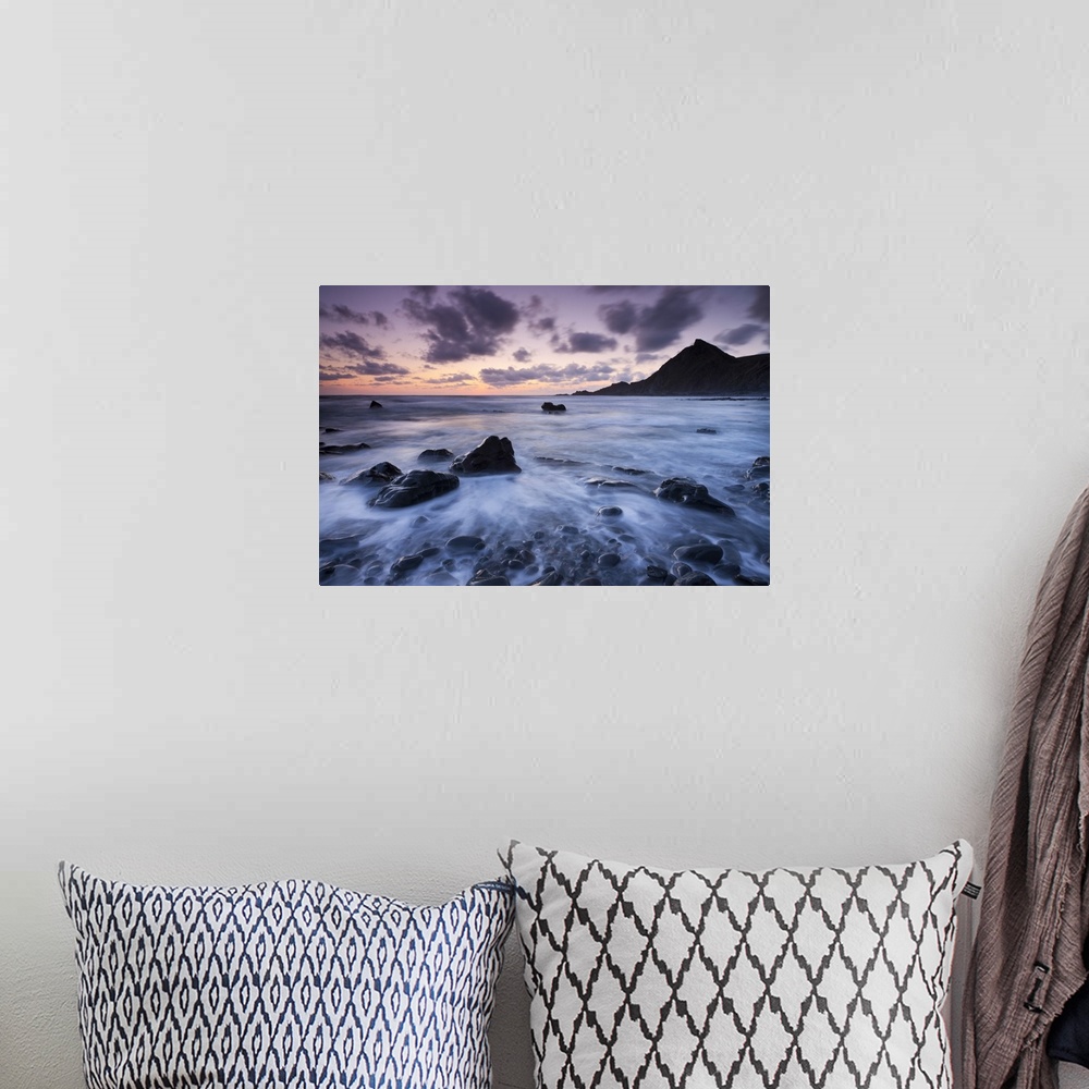 A bohemian room featuring Dusk on the rocky shores of Speke's Mill Mouth in North Devon, England. Summer