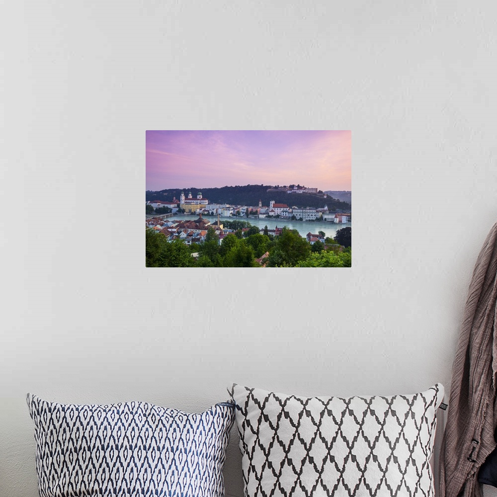 A bohemian room featuring Elevated view over Old Town Passau and The River Danube illuminated at Dawn, Passau, Lower Bavari...