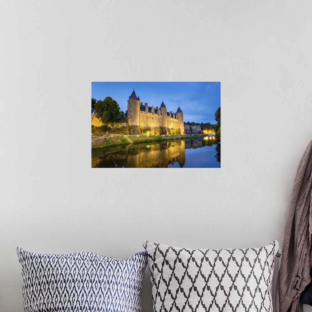 A bohemian room featuring France, Brittany (Bretagne), Morbihan department, Josselin. Chateau de Rohan castle on the Oust R...