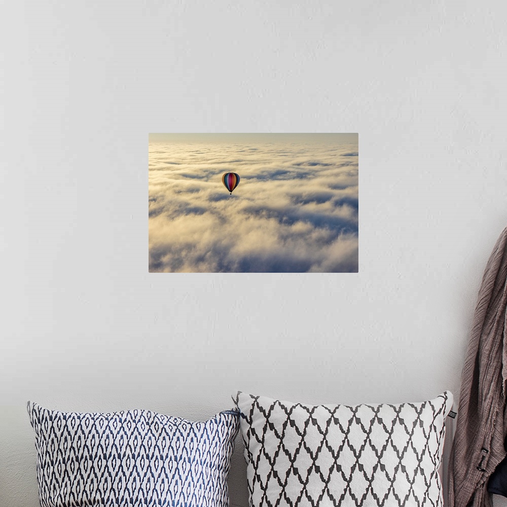 A bohemian room featuring Hot air balloon above low cloud, Yarra Valley, Victoria, Australia.
