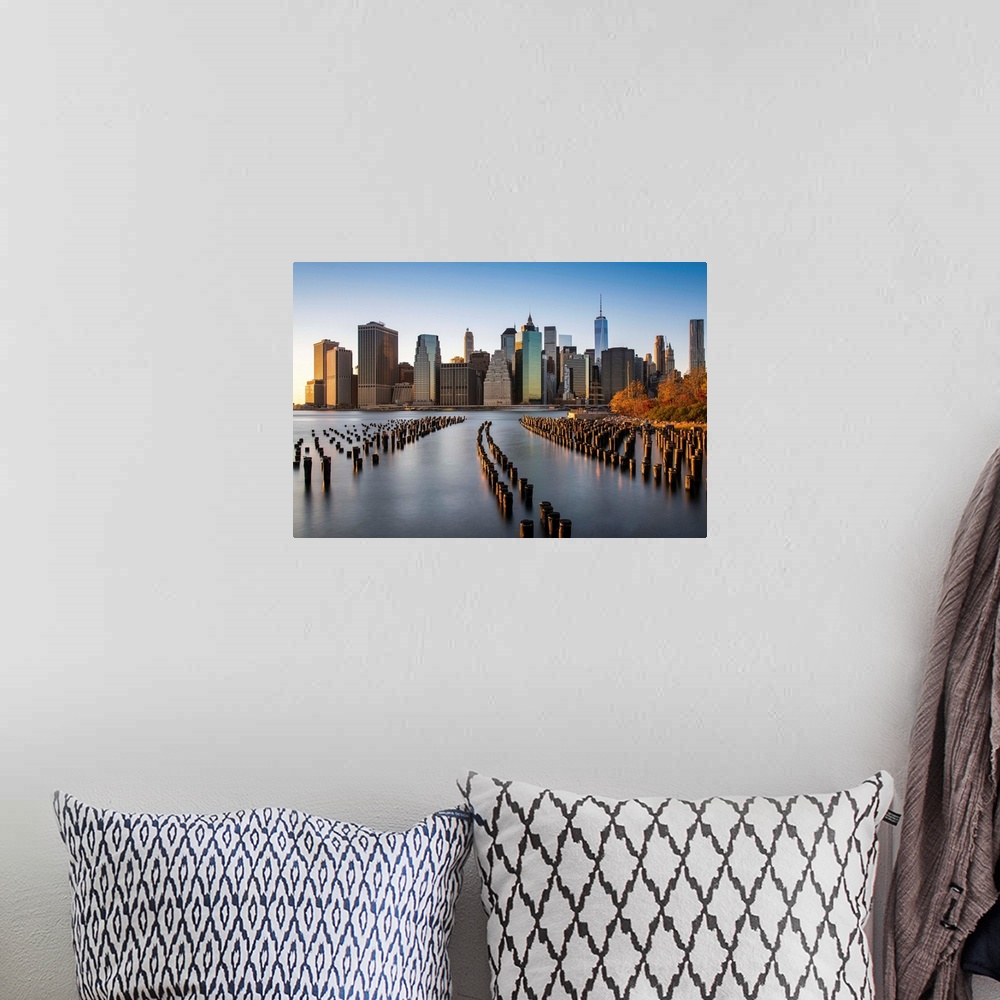 A bohemian room featuring Lower Manhattan skyline at sunset from Brooklyn Bridge Park, Brooklyn, New York, USA.