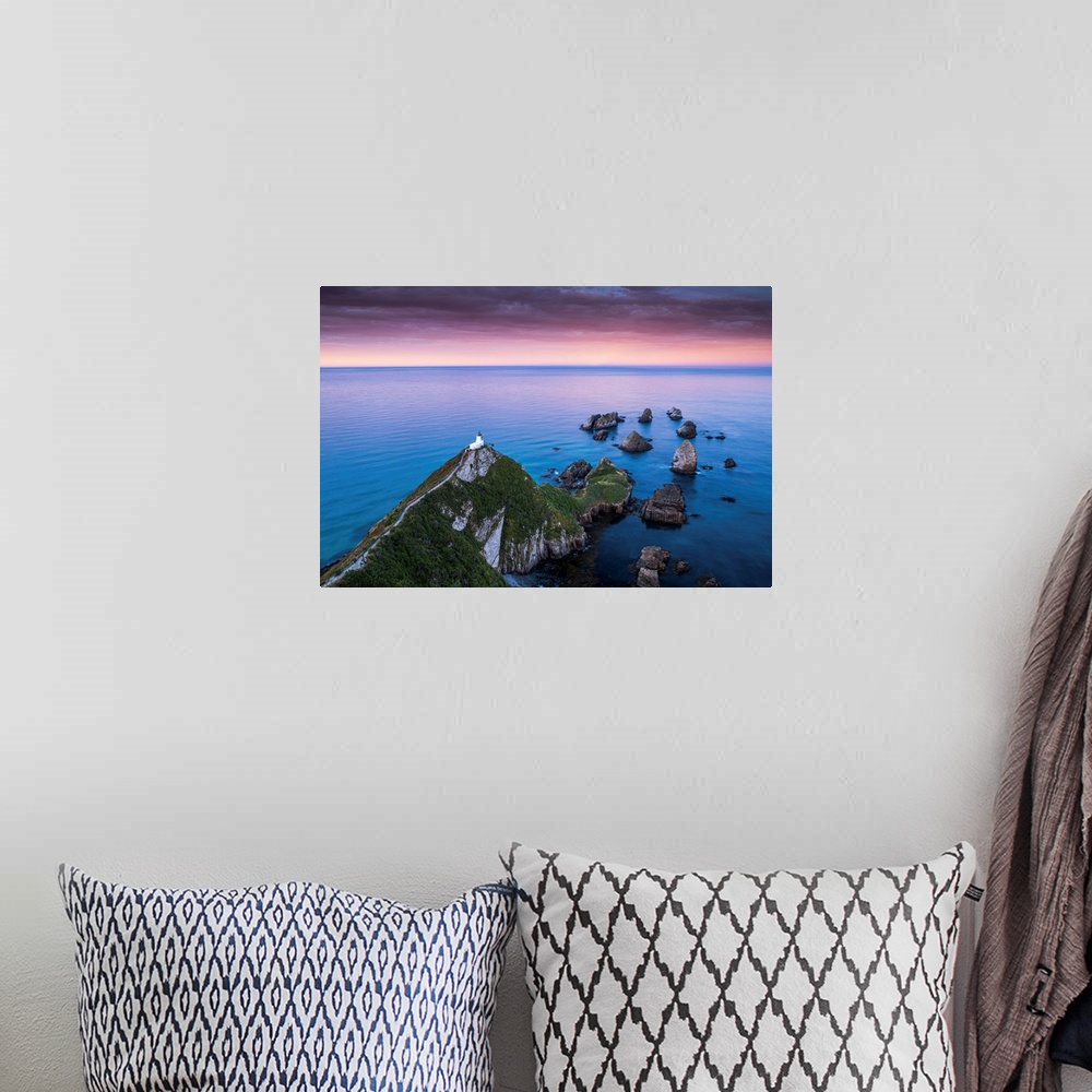 A bohemian room featuring Nugget Point Lighthouse At Sunrise, New Zealand