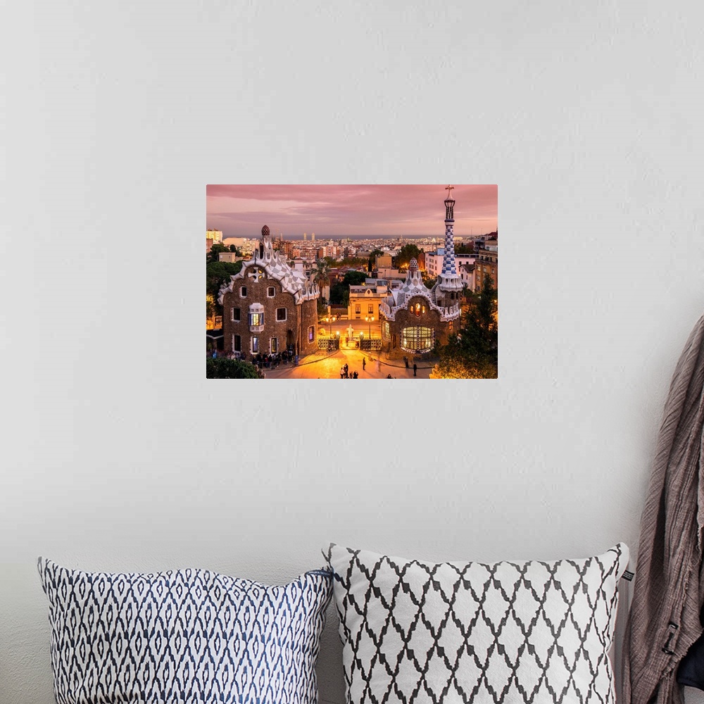 A bohemian room featuring Park Guell with city skyline behind at dusk, Barcelona, Catalonia, Spain.