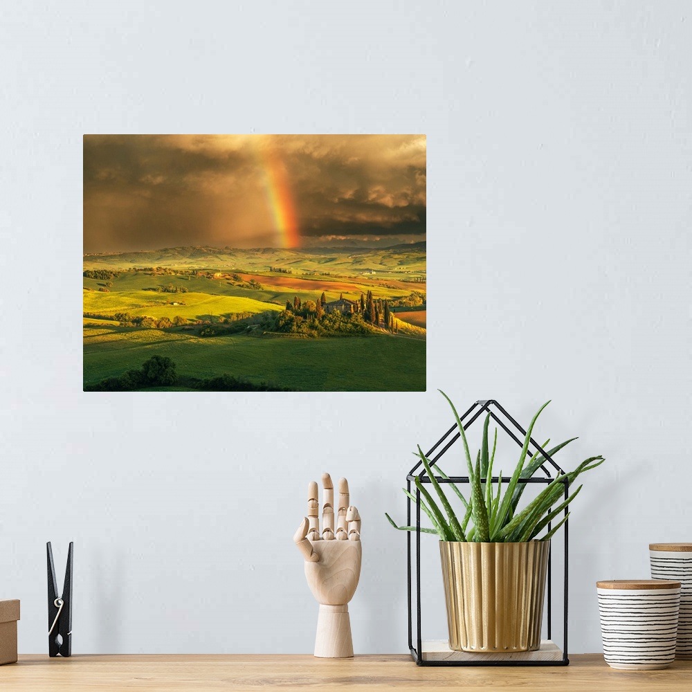 A bohemian room featuring Podere Belvedere after a storm with rainbow, Val d'Orcia, Tuscany, Italy