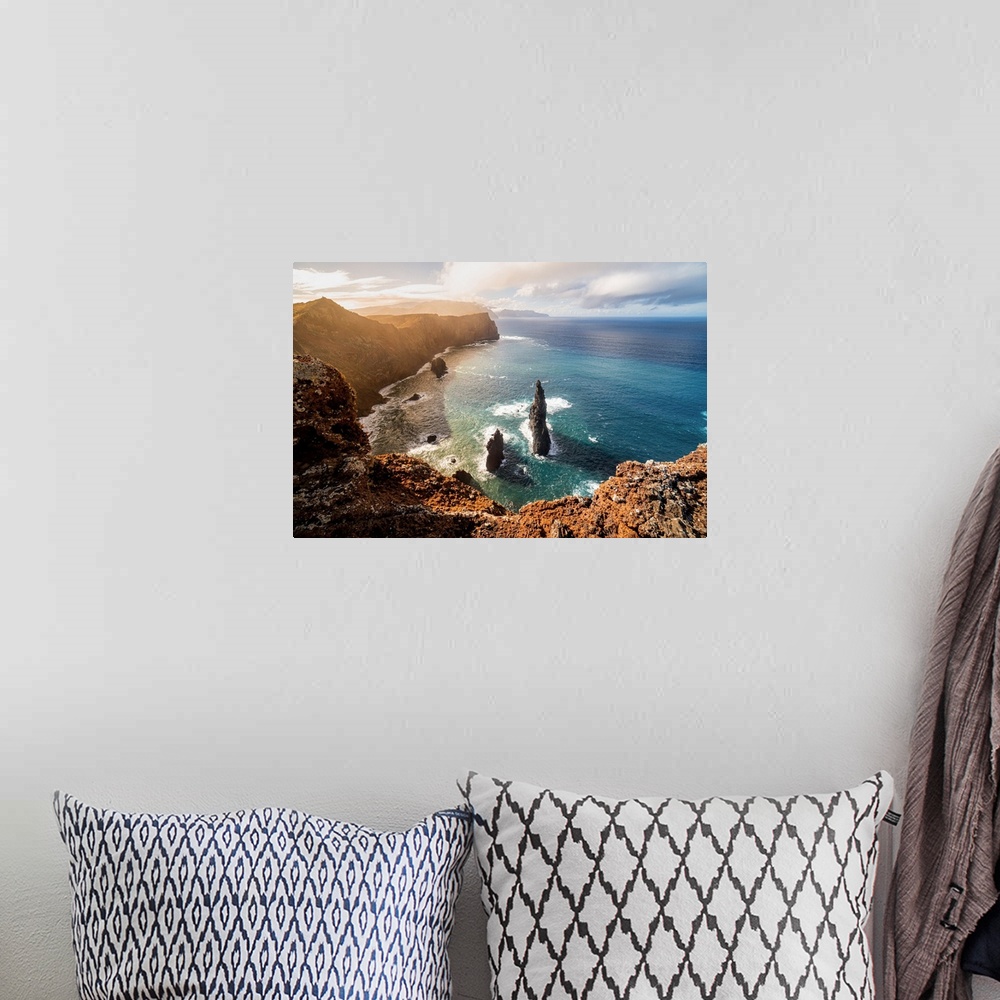 A bohemian room featuring The rocks, the sea and the cliff at sunset above the miradouro do San Lourenco, Madeira Island, P...