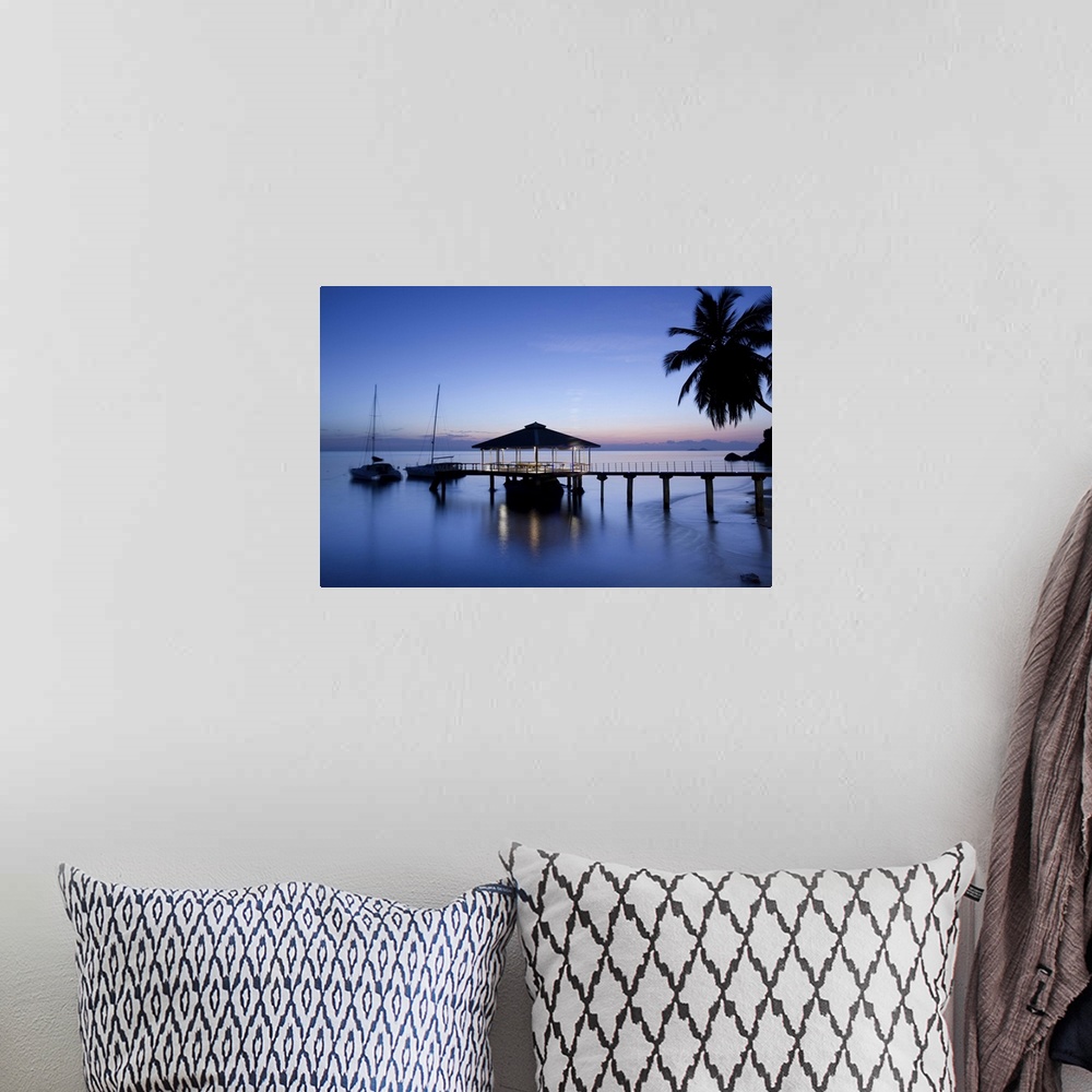 A bohemian room featuring Seychelles, Praslin Island, Anse Bois de Rose, pier at the Coco de Mer hotel, sunset