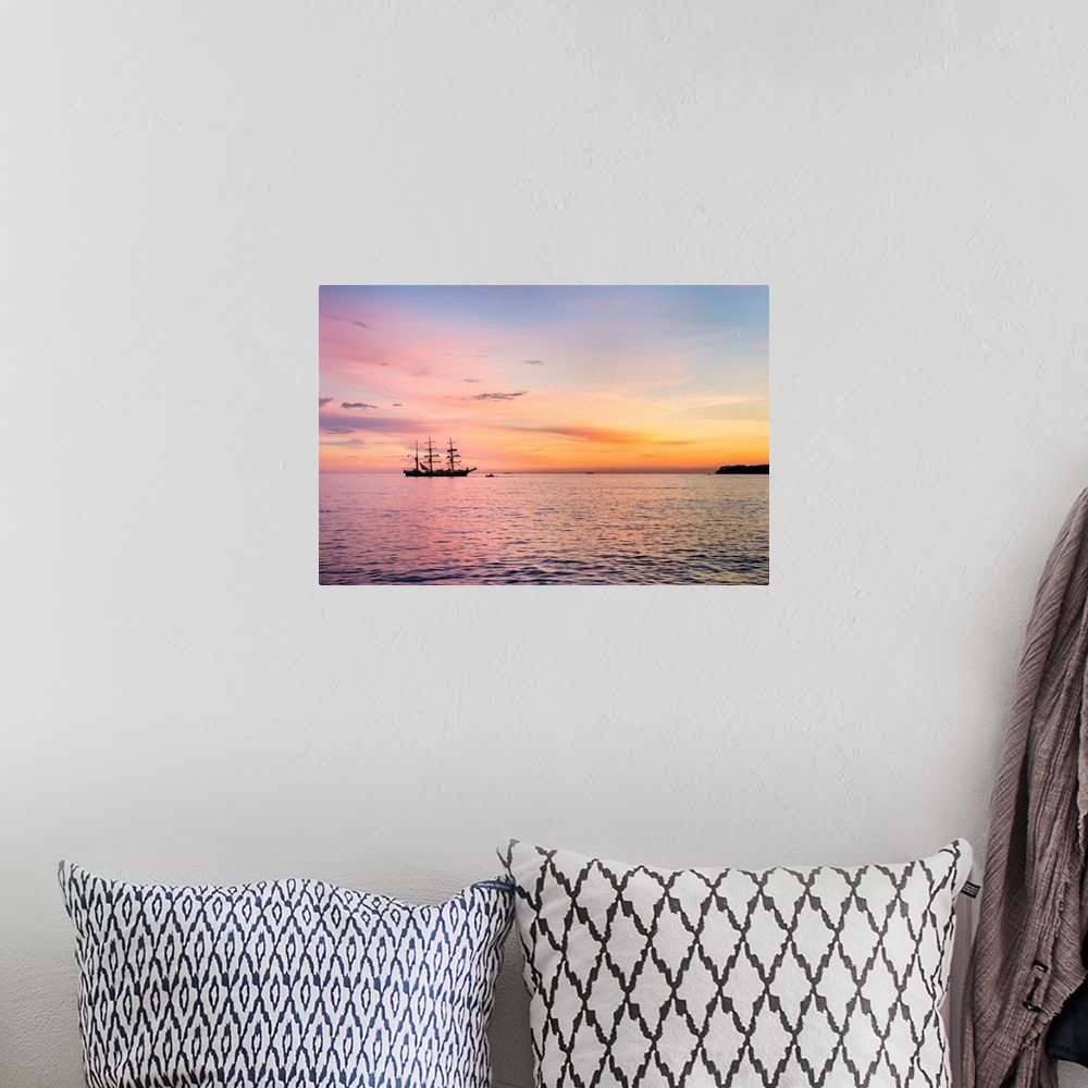 A bohemian room featuring Silhouette of sailing ship at sunset off the coast of Cassis, Bouches-du-Rhone, Provence-Alpes-Co...