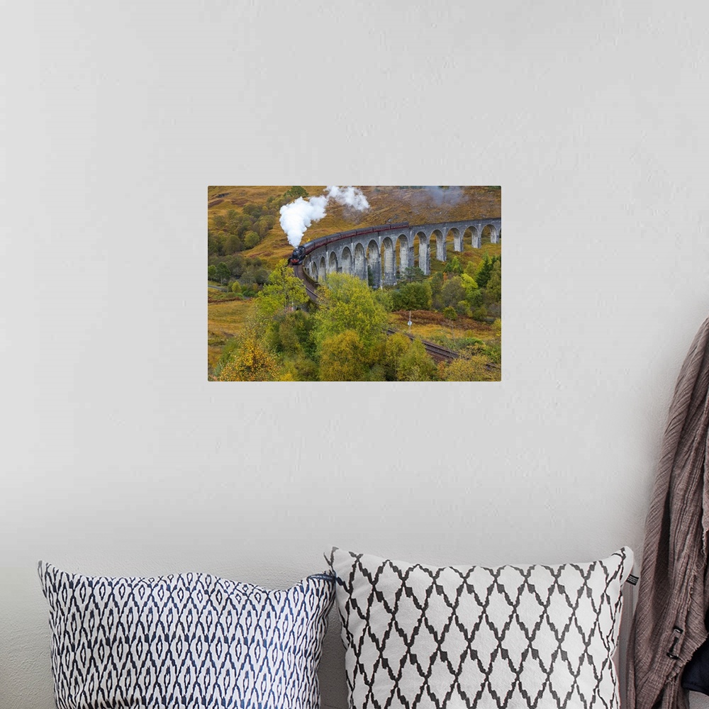A bohemian room featuring Jacobite steam train crossing Glenfinnan viaduct, Lochaber, nr Fort William, Highlands, Scotland, UK