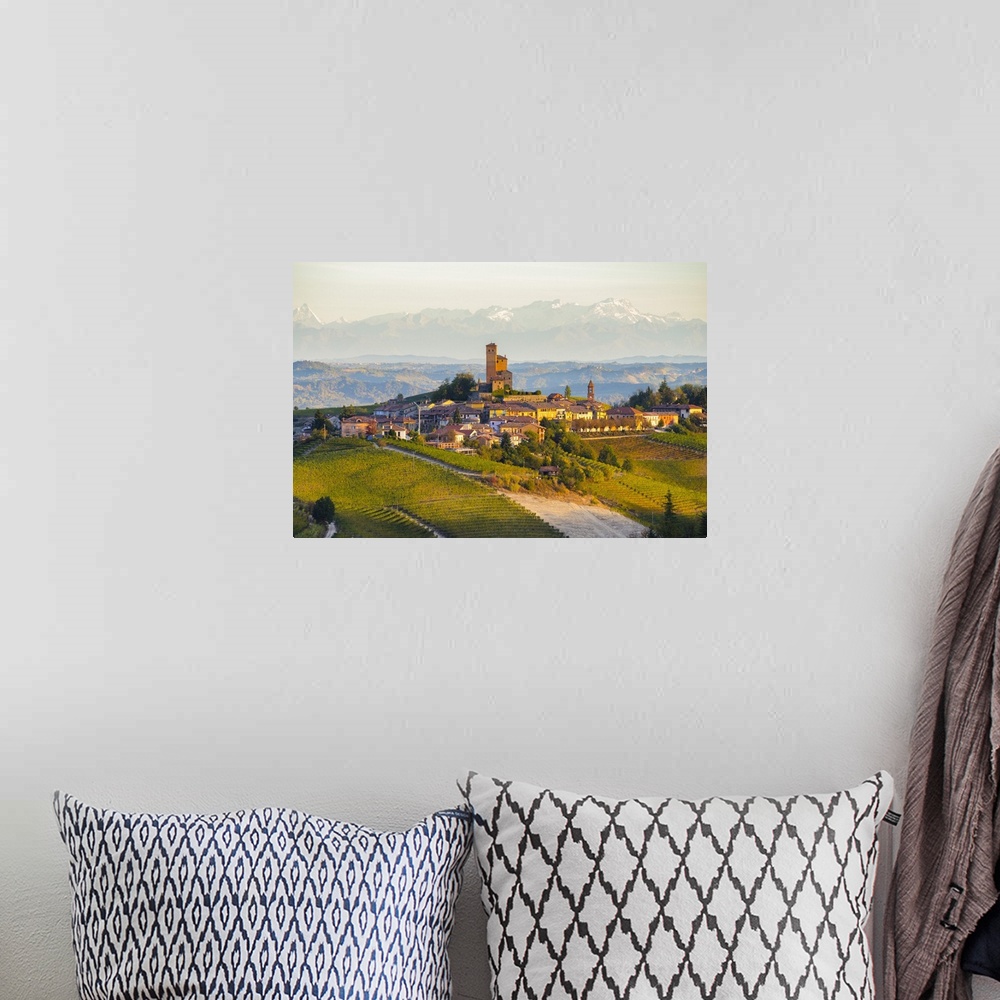 A bohemian room featuring The vineyards of Serralunga d'Alba and Alps in background during autumn sunrise, Serralunga d'Alb...