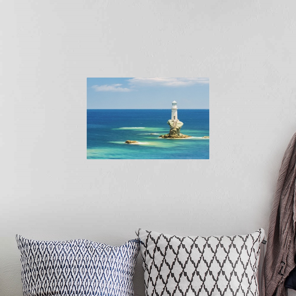 A bohemian room featuring Tourlitis lighthouse, the first automatic offshore lighthouse in Greece, Andros, Cyclades Archipe...