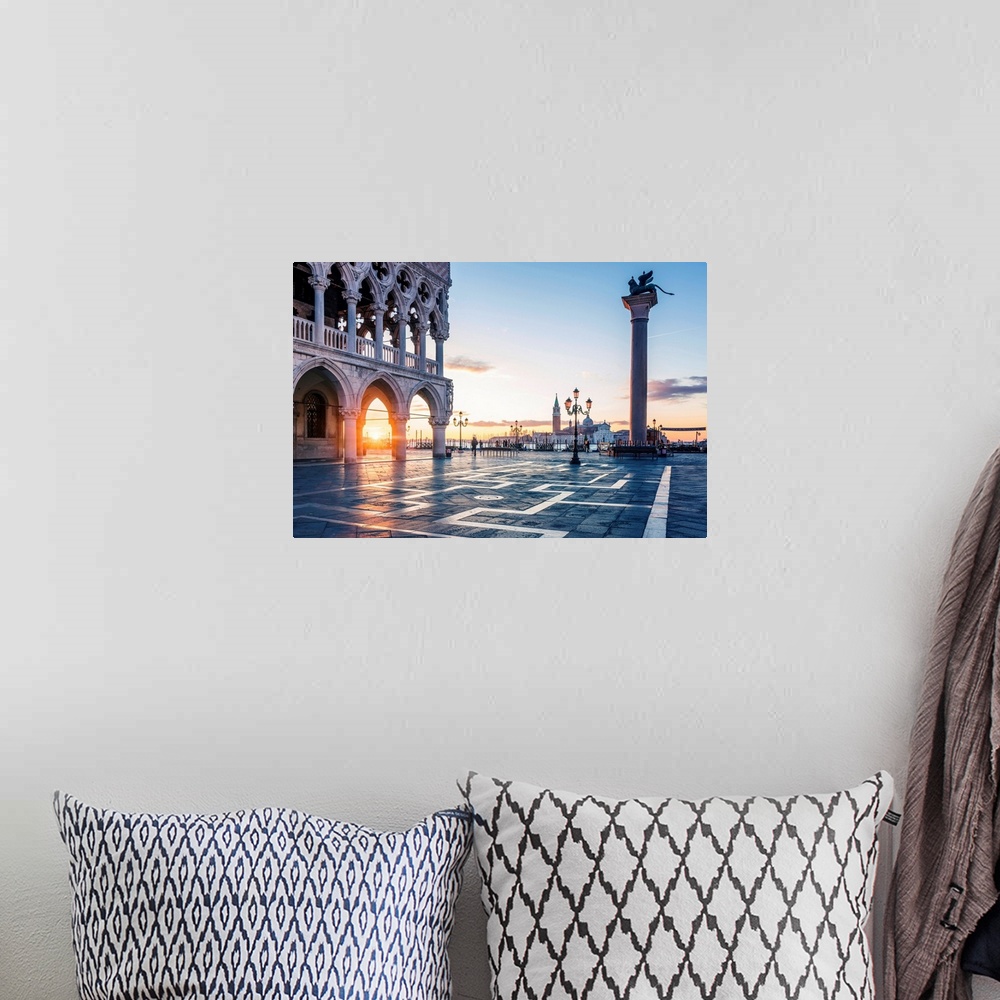 A bohemian room featuring Venice, Veneto, Italy. Sunrise Through The Arches Of Doge's Palace In Piazzetta San Marco.