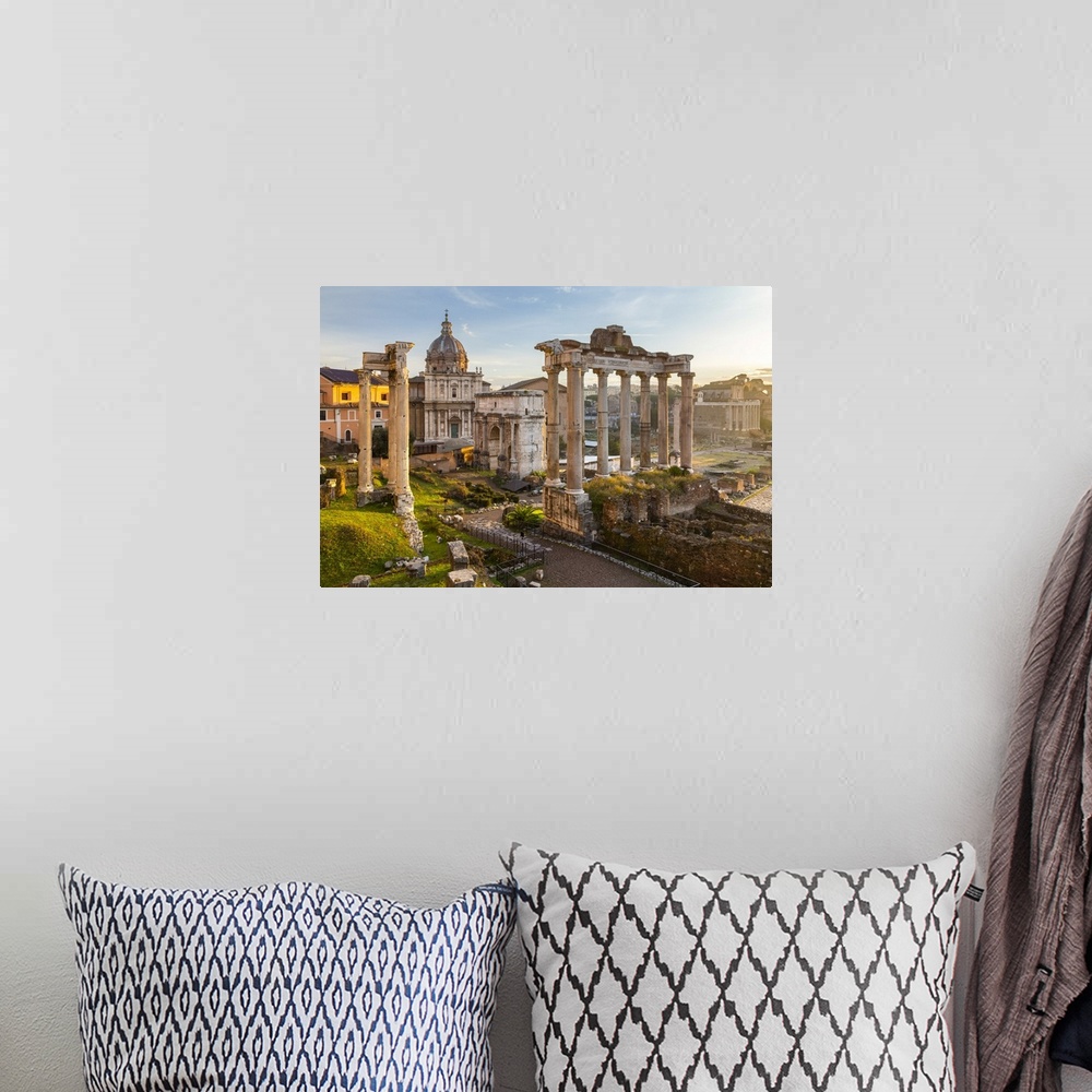 A bohemian room featuring View of the ruins of Fori Imperiali from the Campidoglio at dawn. Rome, Rome district, Lazio, Italy.