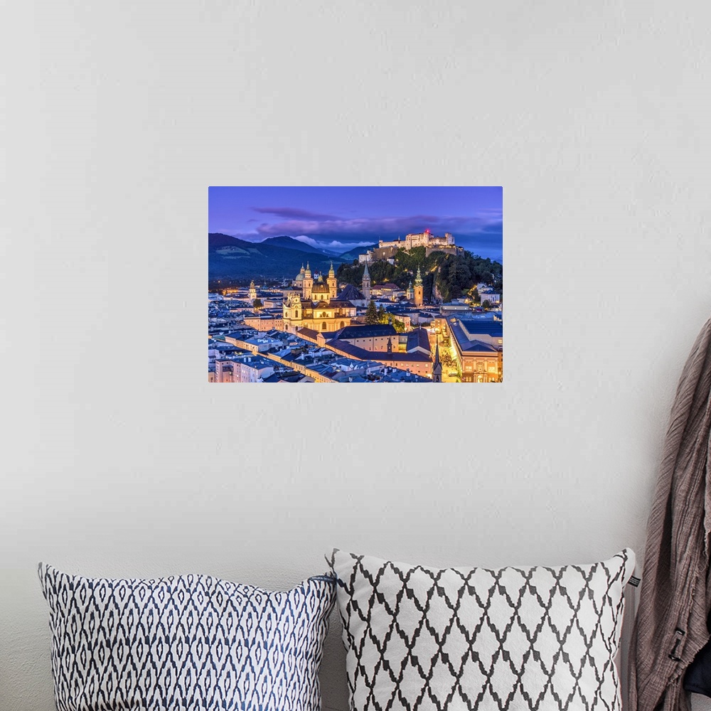 A bohemian room featuring View over the old town and Hohensalzburg Castle at dusk, Salzburg, Austria