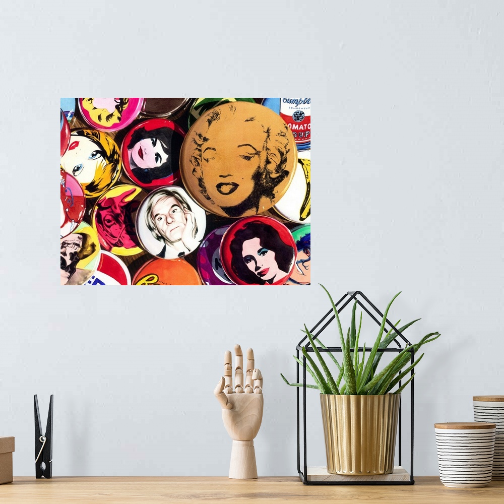 A bohemian room featuring Watercolor painting of a collection of Andy Warhol pins on a wooden table.