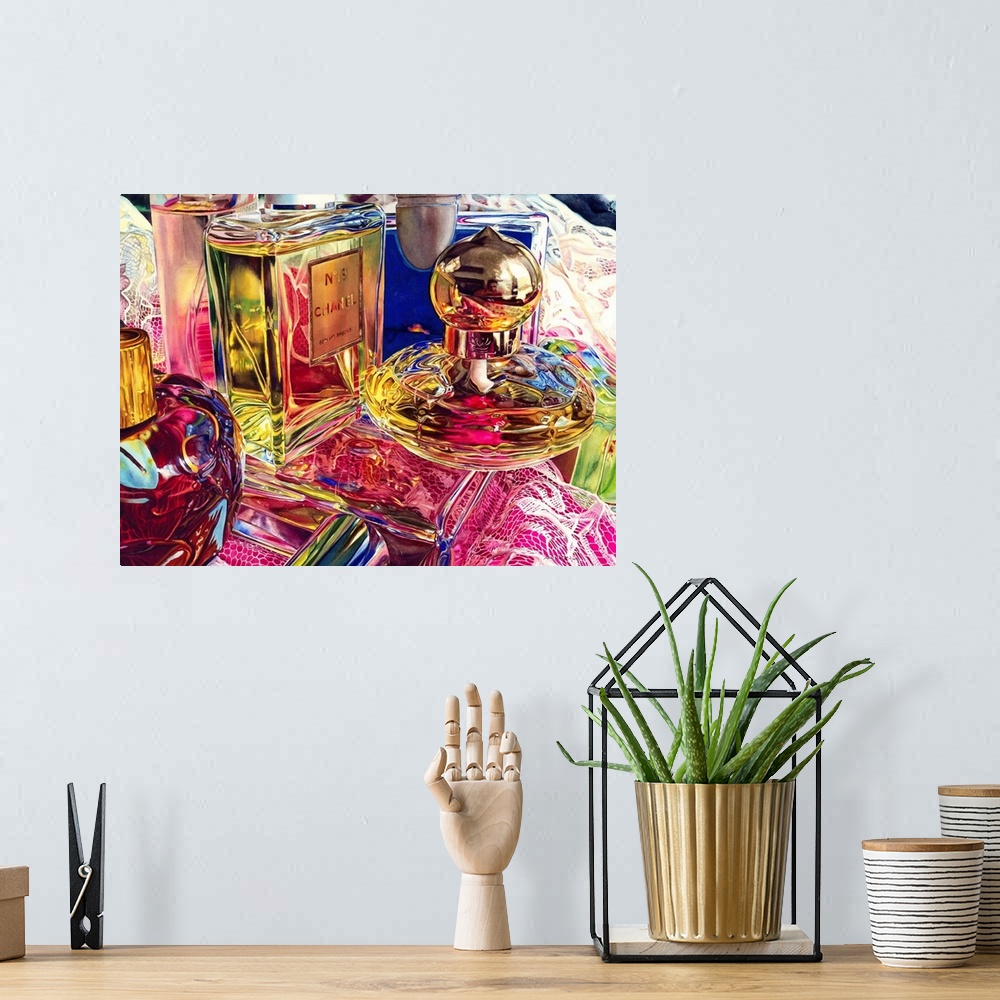 A bohemian room featuring A watercolor painting of perfume bottles stacked on top of a prom dress on a table.
