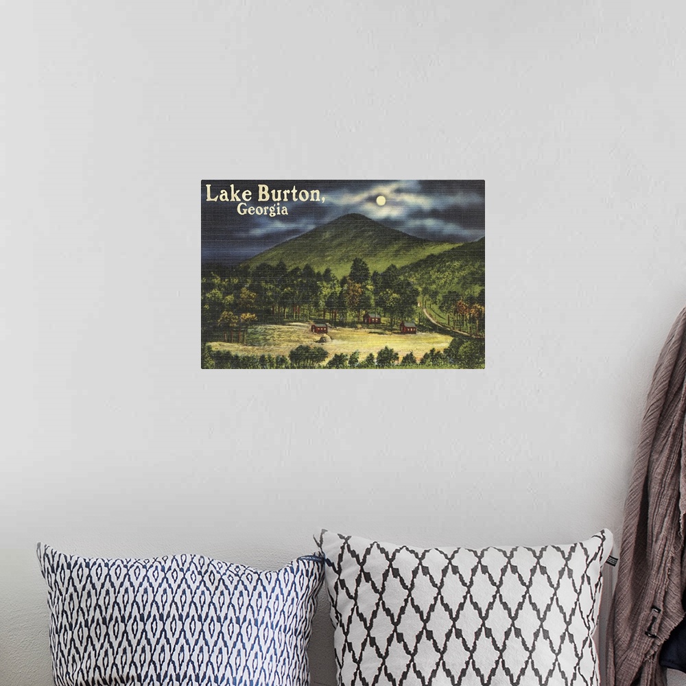 A bohemian room featuring Retro stylized art poster of a valley at night moon lightly shrouded by a cloudy sky.