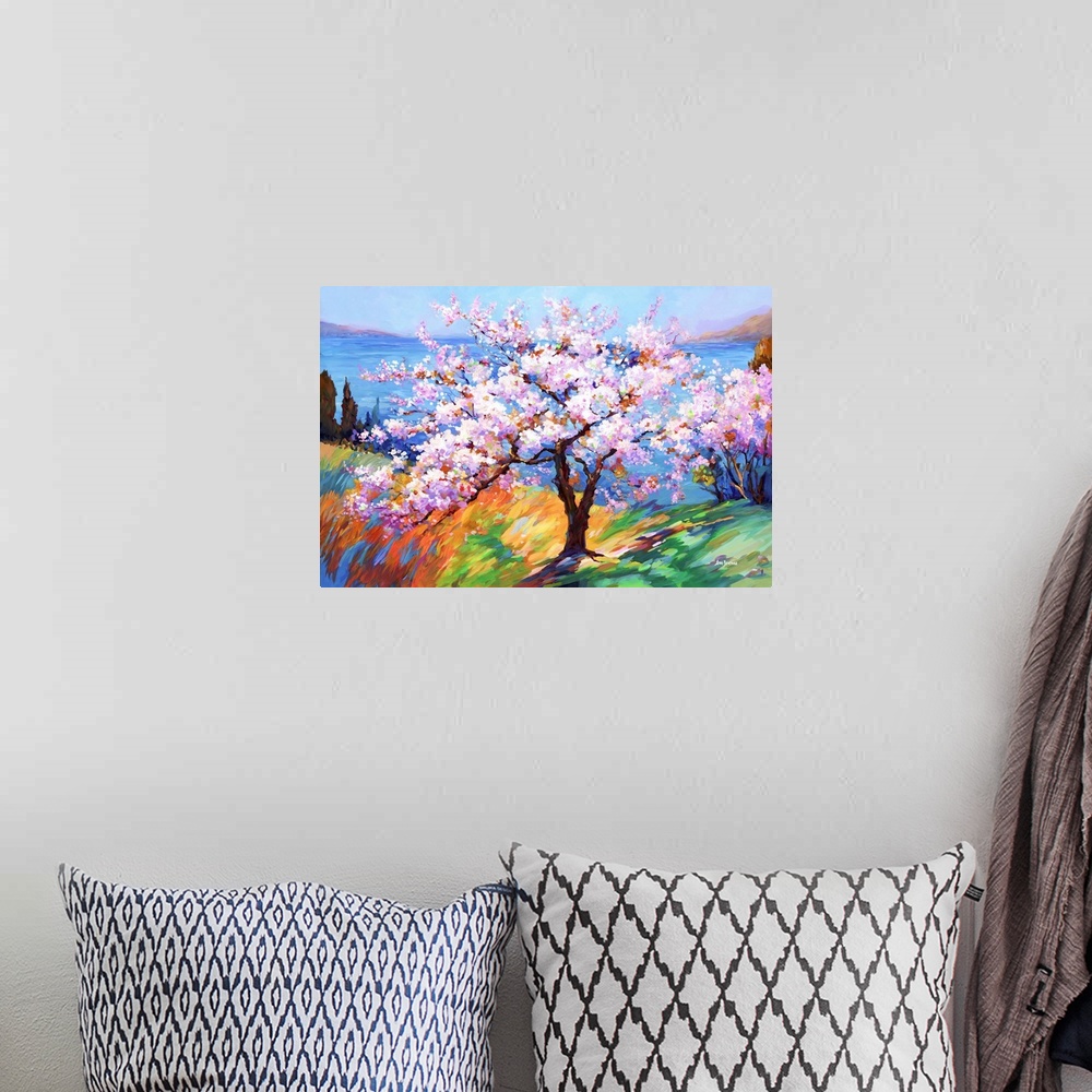 A bohemian room featuring This impressionistic artwork captures a cherry blossom tree's delicate beauty, arrayed in soft, c...