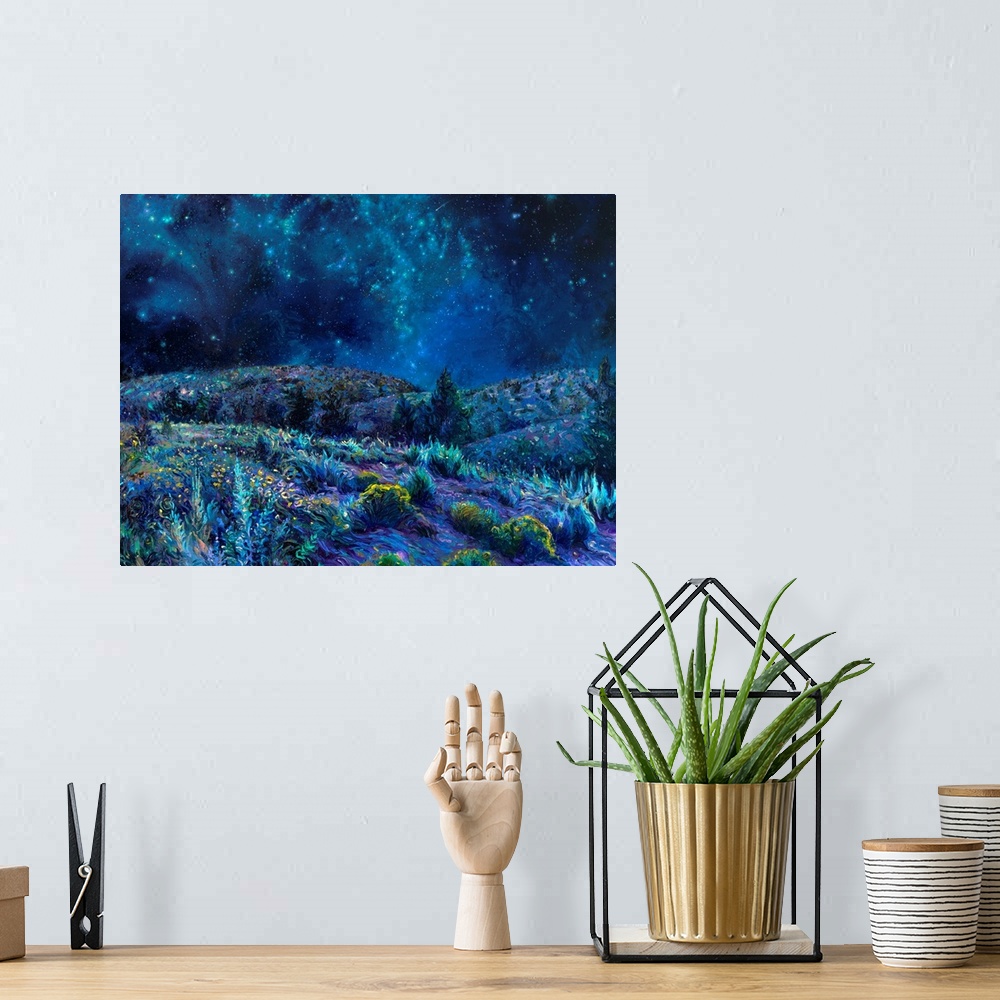 A bohemian room featuring Brightly colored contemporary artwork of a cool toned landscape of the night sky and a field.