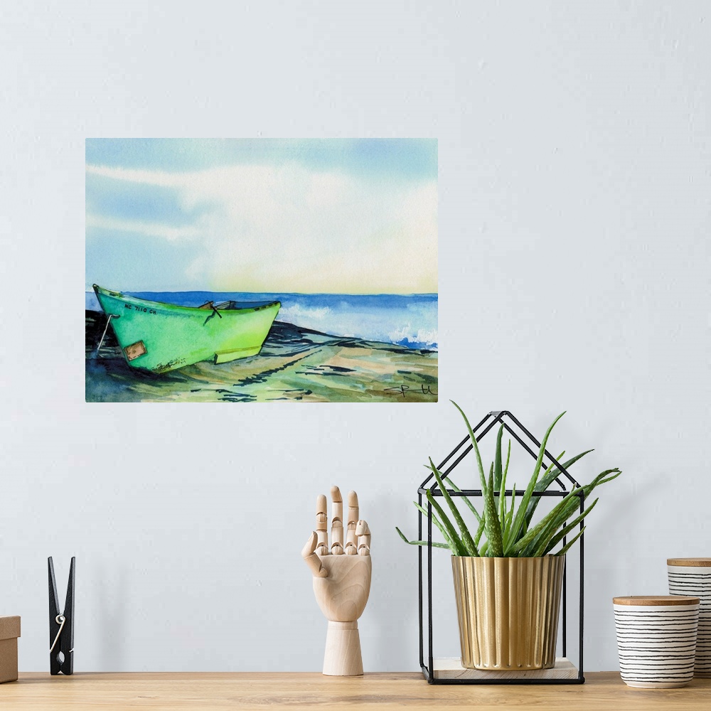 A bohemian room featuring A green boat on a rocky shore near the ocean.