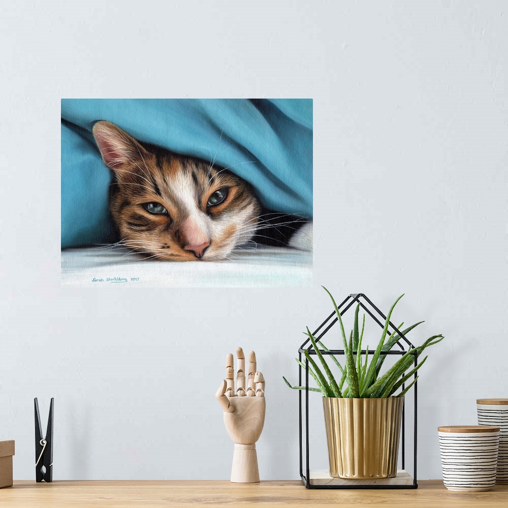 A bohemian room featuring Oil painting on canvas of a domestic cat under a blanket.