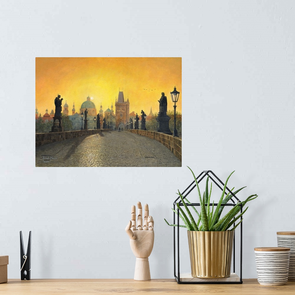 A bohemian room featuring Contemporary artwork of a view across a long old bridge lined with statues, toward a city filled ...