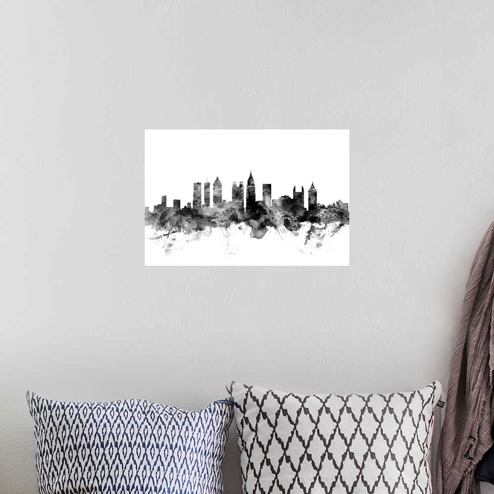 A bohemian room featuring Contemporary artwork of the Atlanta city skyline in black watercolor paint splashes.