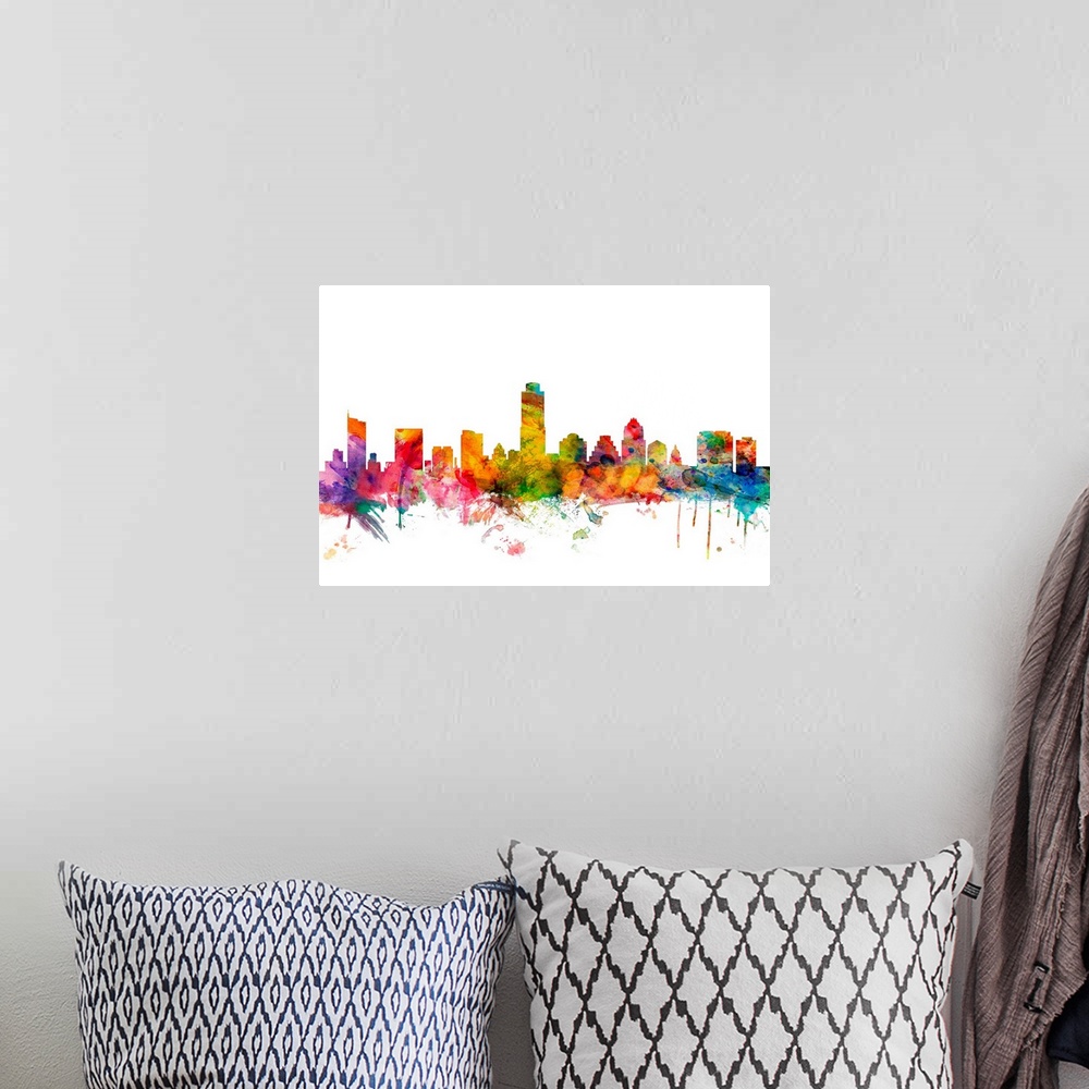 A bohemian room featuring Watercolor artwork of the Austin skyline against a white background.