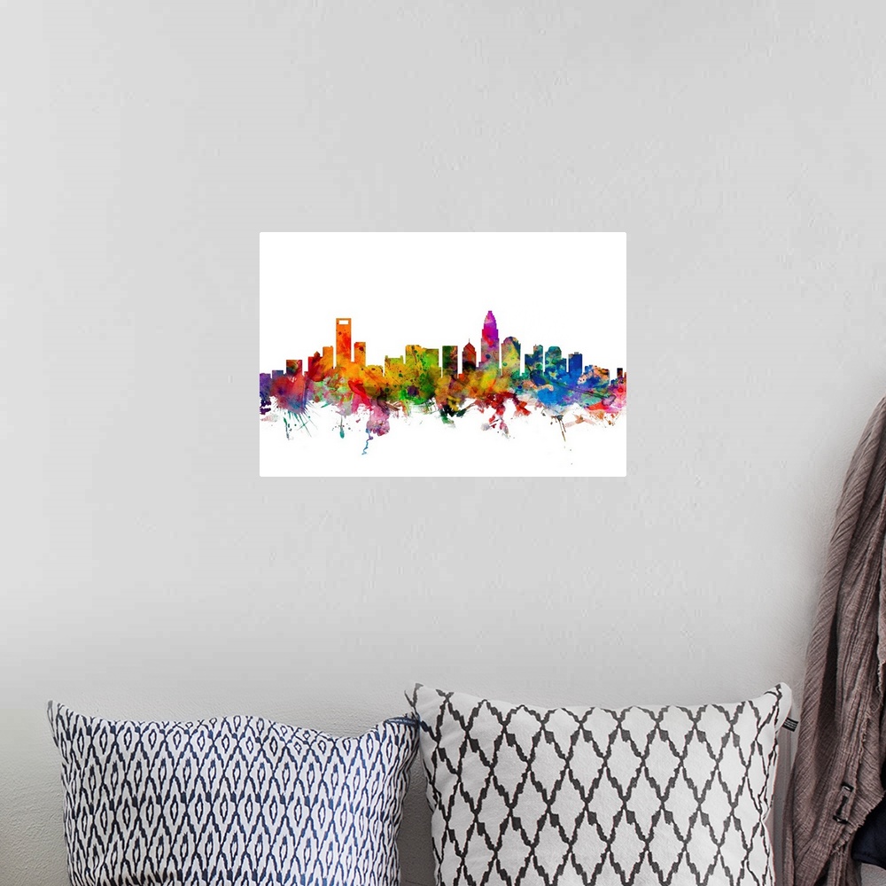 A bohemian room featuring Watercolor artwork of the Charlotte skyline against a white background.