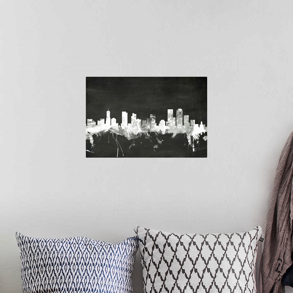 A bohemian room featuring Smokey dark watercolor silhouette of the Denver city skyline against chalkboard background.