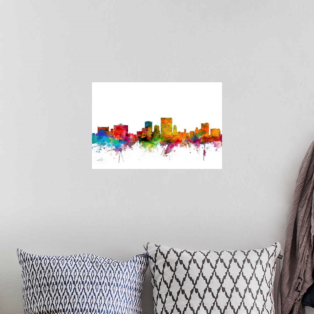 A bohemian room featuring Watercolor artwork of the El Paso skyline against a white background.