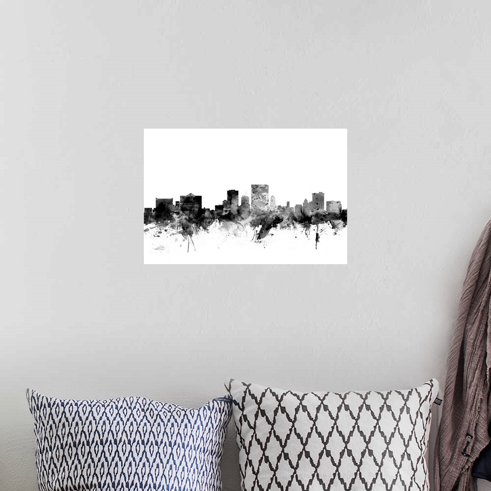 A bohemian room featuring Contemporary artwork of the El Paso city skyline in black watercolor paint splashes.