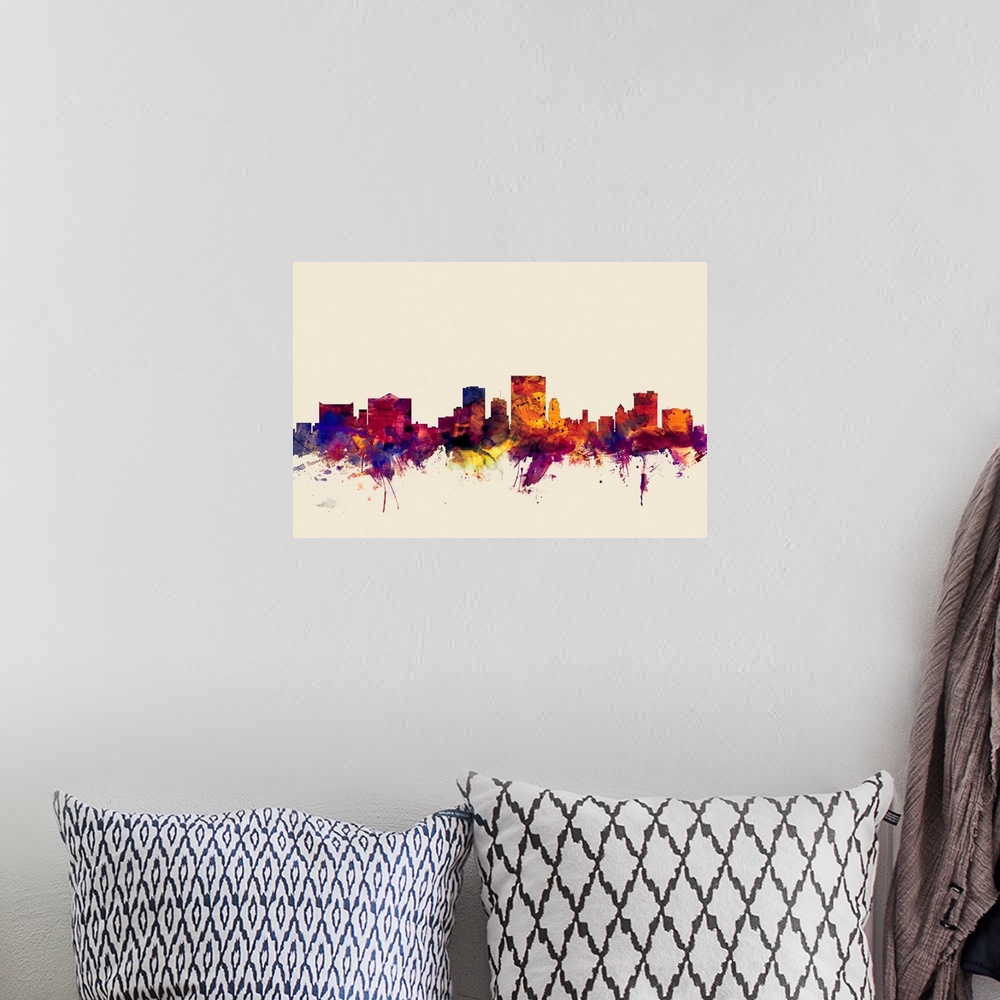 A bohemian room featuring Contemporary artwork of the El Paso city skyline in watercolor paint splashes.