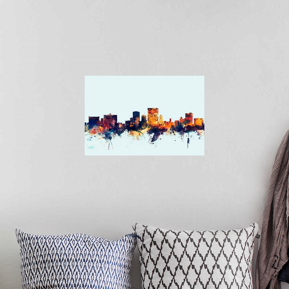 A bohemian room featuring Dark watercolor silhouette of the El Paso city skyline against a light blue background.