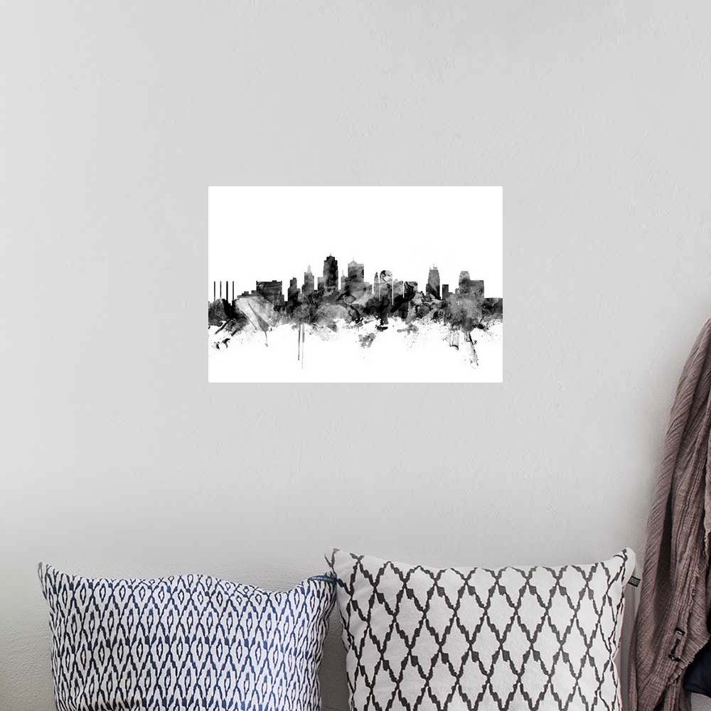A bohemian room featuring Contemporary artwork of the Kansas City skyline in black watercolor paint splashes.