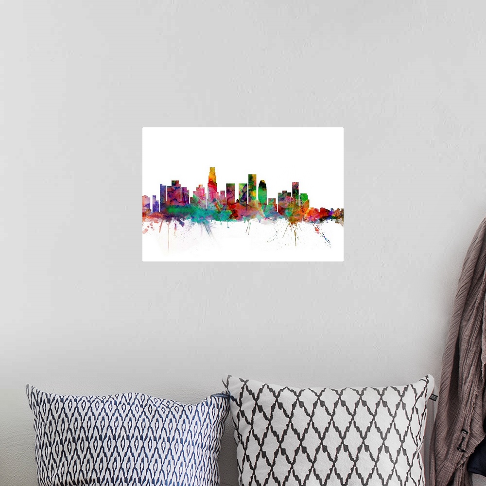 A bohemian room featuring Watercolor artwork of the Los Angeles skyline against a white background.