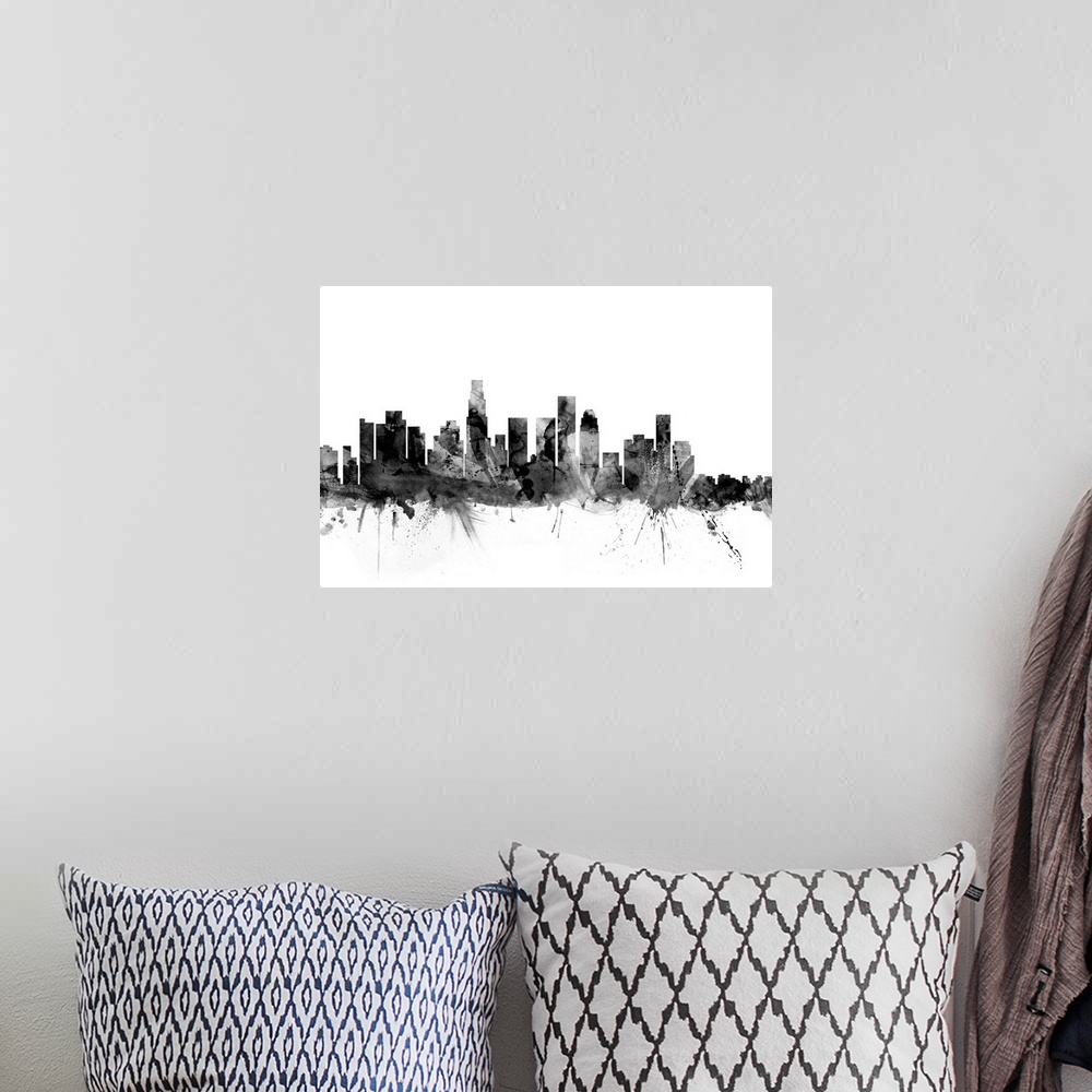 A bohemian room featuring Contemporary artwork of the Los Angeles city skyline in black watercolor paint splashes.