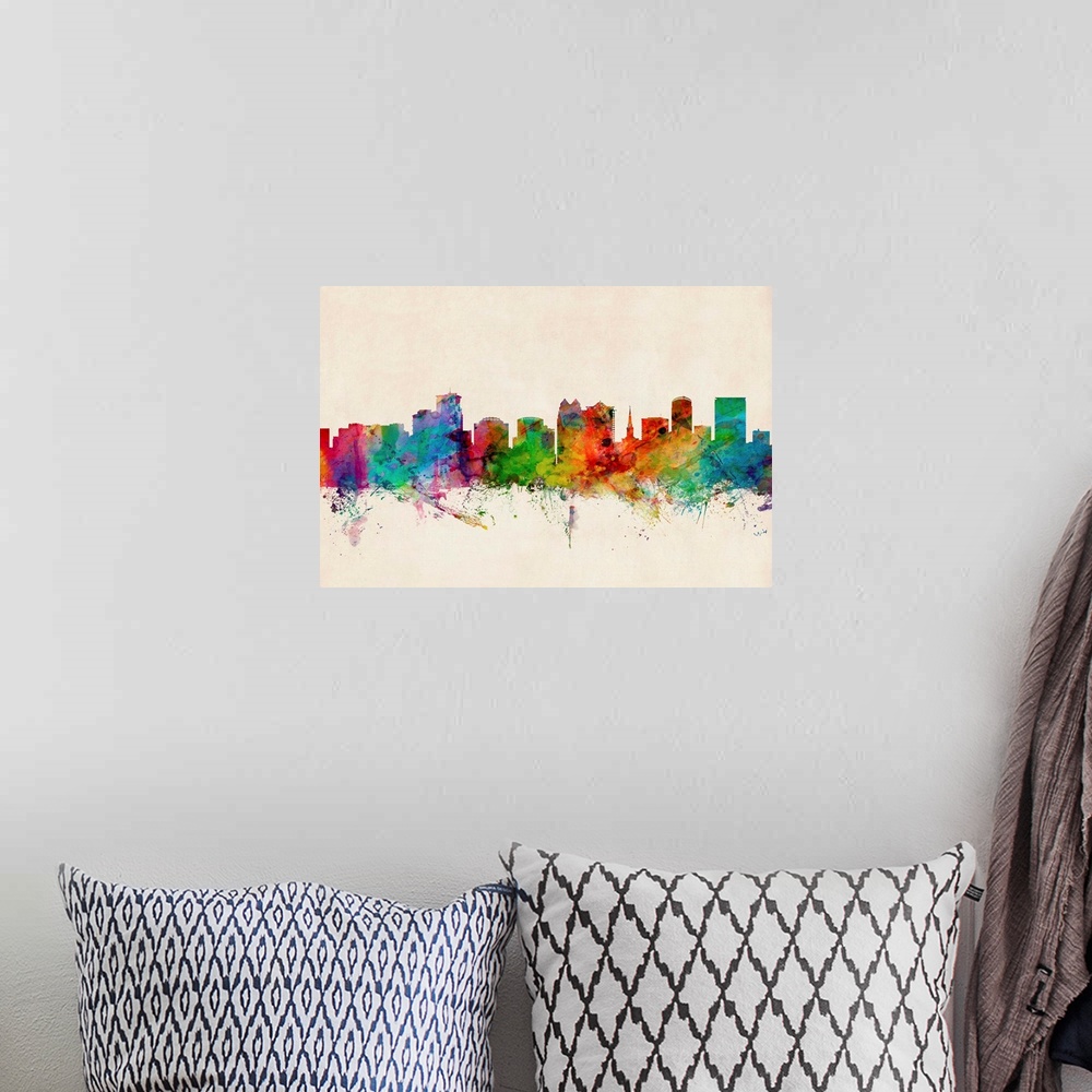 A bohemian room featuring Contemporary piece of artwork of the Orlando skyline made of colorful paint splashes.