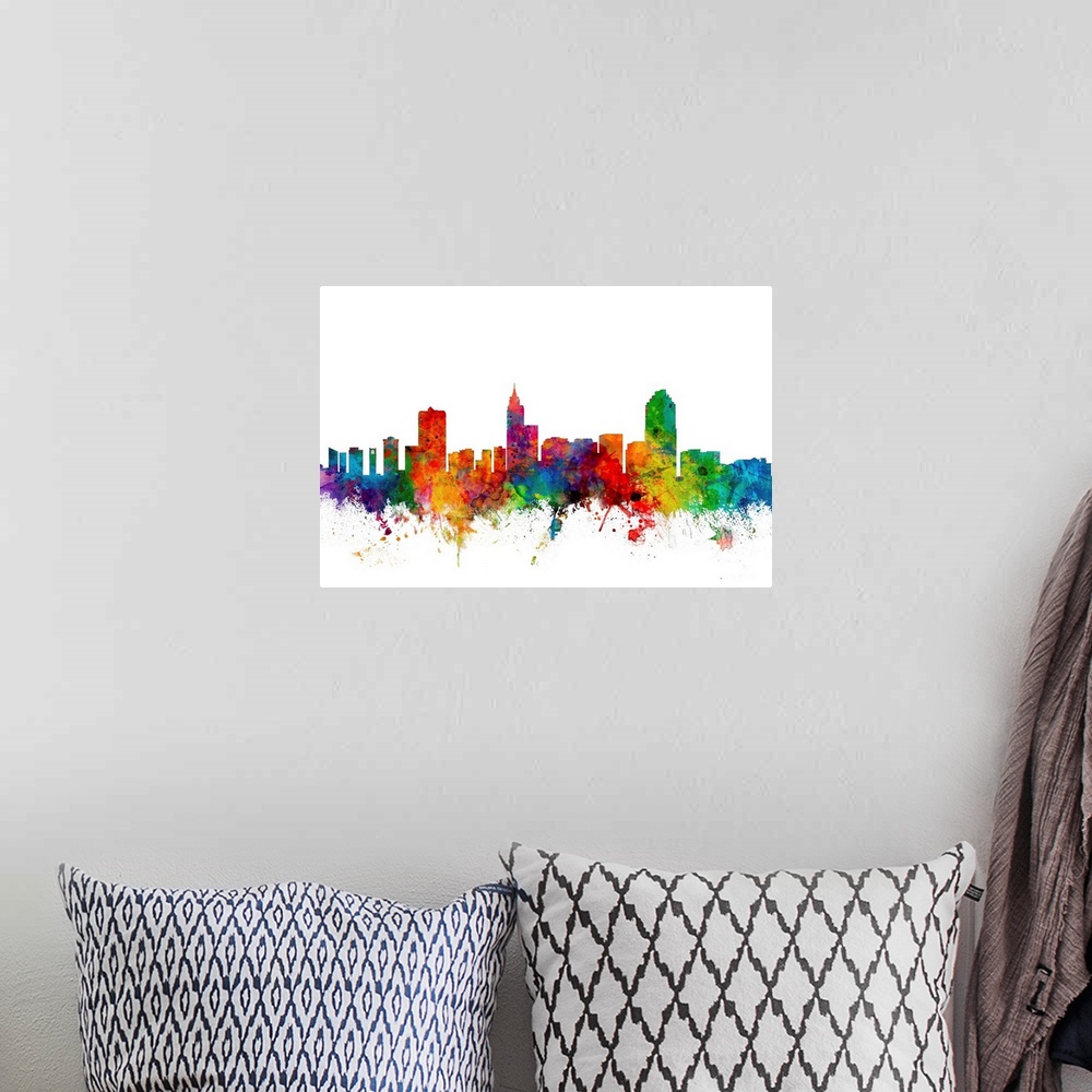 A bohemian room featuring Colorful watercolor splattered silhouetted of the Raleigh city skyline.