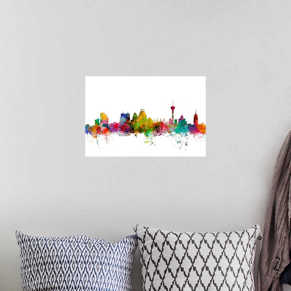 A bohemian room featuring Watercolor artwork of the San Antonio skyline against a white background.