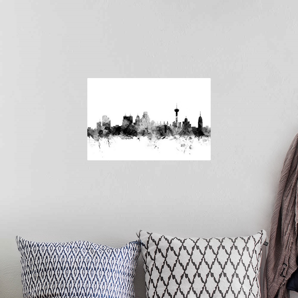 A bohemian room featuring Contemporary artwork of the San Antonio city skyline in black watercolor paint splashes.