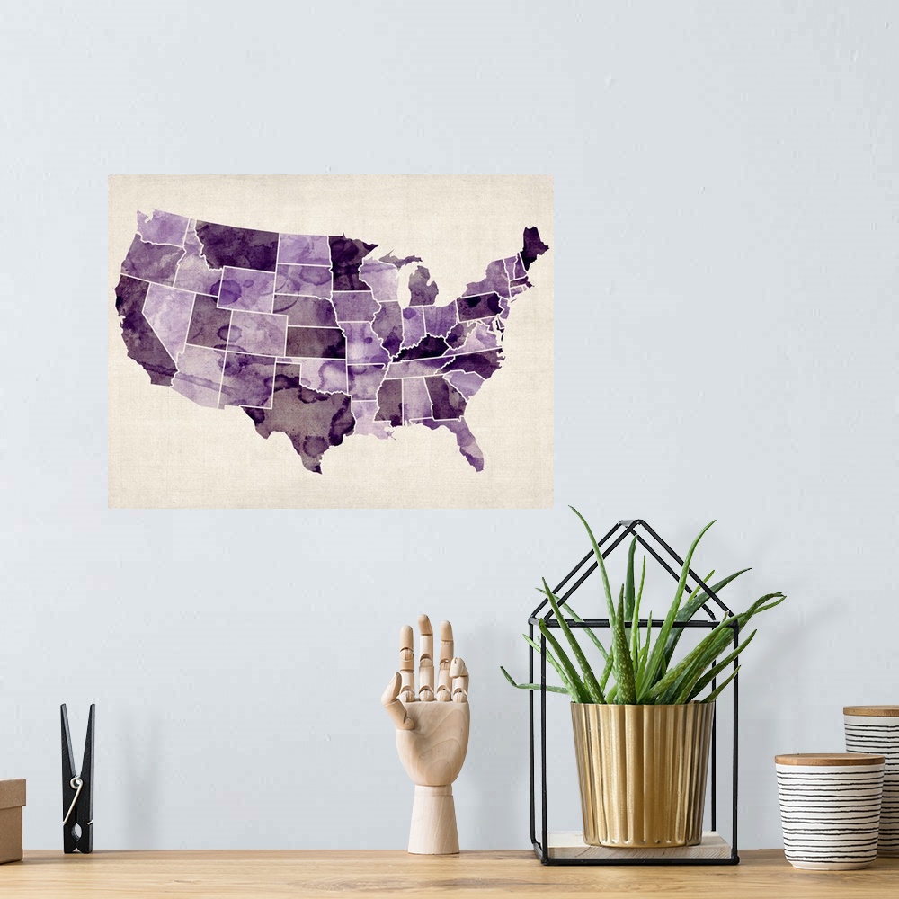 A bohemian room featuring Contemporary artwork of a map of the United States in purple watercolor tones.