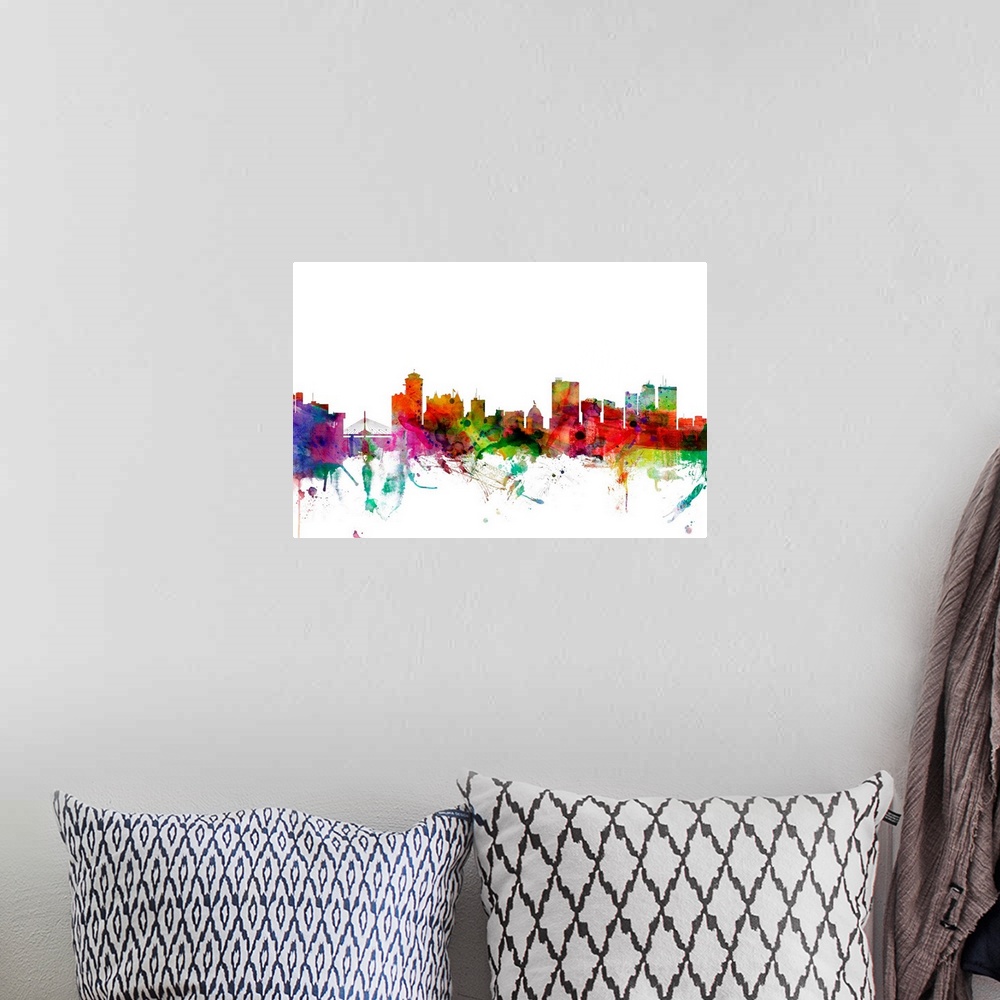 A bohemian room featuring Watercolor artwork of the Winnipeg skyline against a white background.