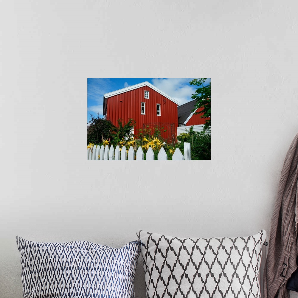 A bohemian room featuring Norway, Skudeneshavn: red house and white fence