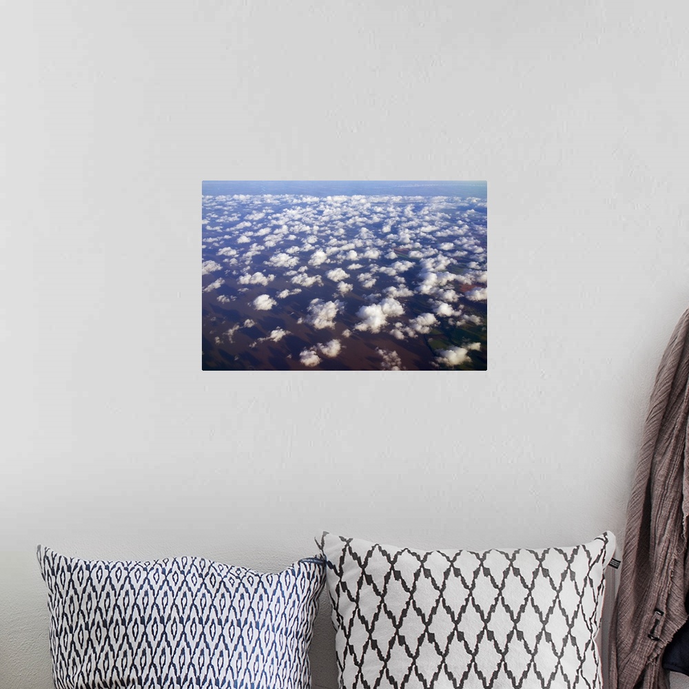 A bohemian room featuring Scattered clouds, aerial over Rio de la Plata, Argentina.