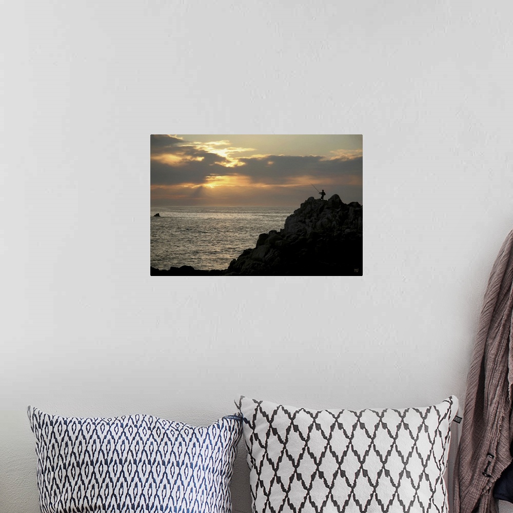 A bohemian room featuring A fisherman casts his line at sunset in Pacific Grove, California, in this alluring piece of artw...