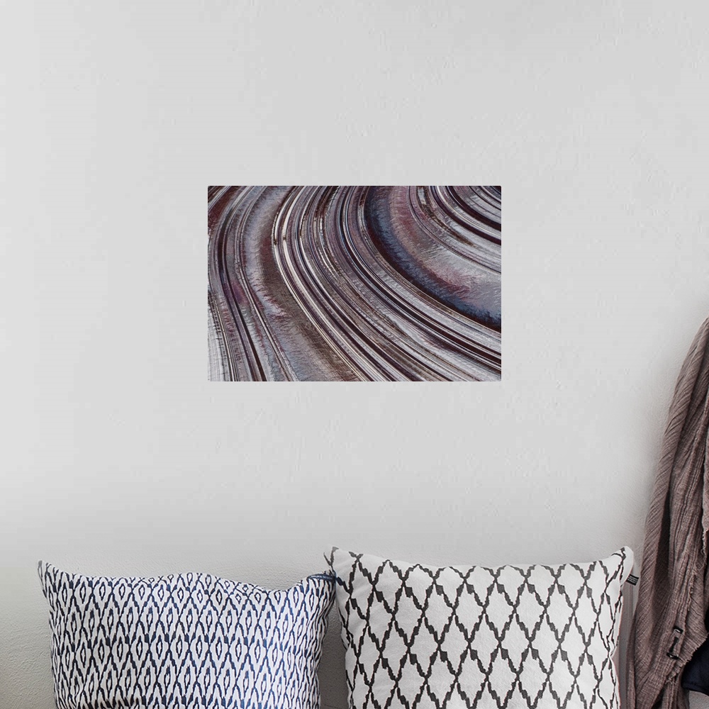 A bohemian room featuring Abstract photo on canvas of curving indentions.