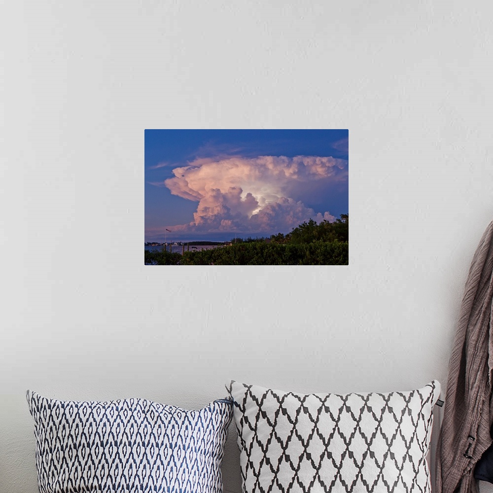 A bohemian room featuring A supercell anvil cloud filled with discharging electricity.